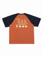 Play Wild kids colorblock quick-dry raglan tee in burnt orange and navy, flat lay