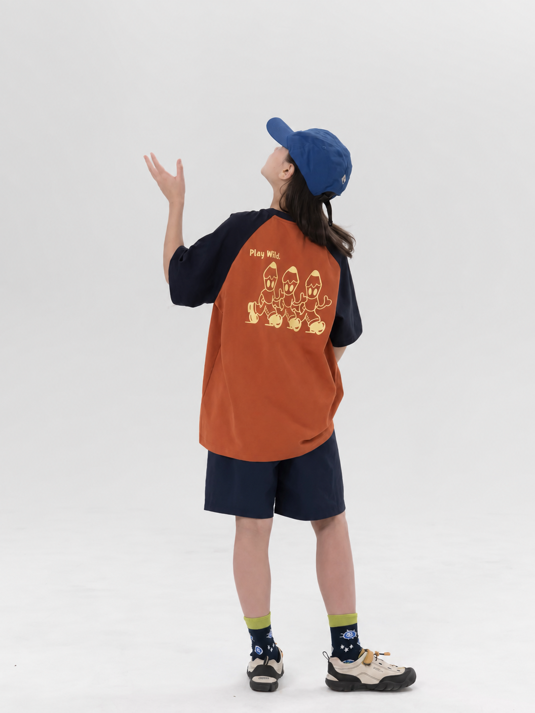 Play Wild kids quick-dry raglan tee in burnt orange and navy, back view