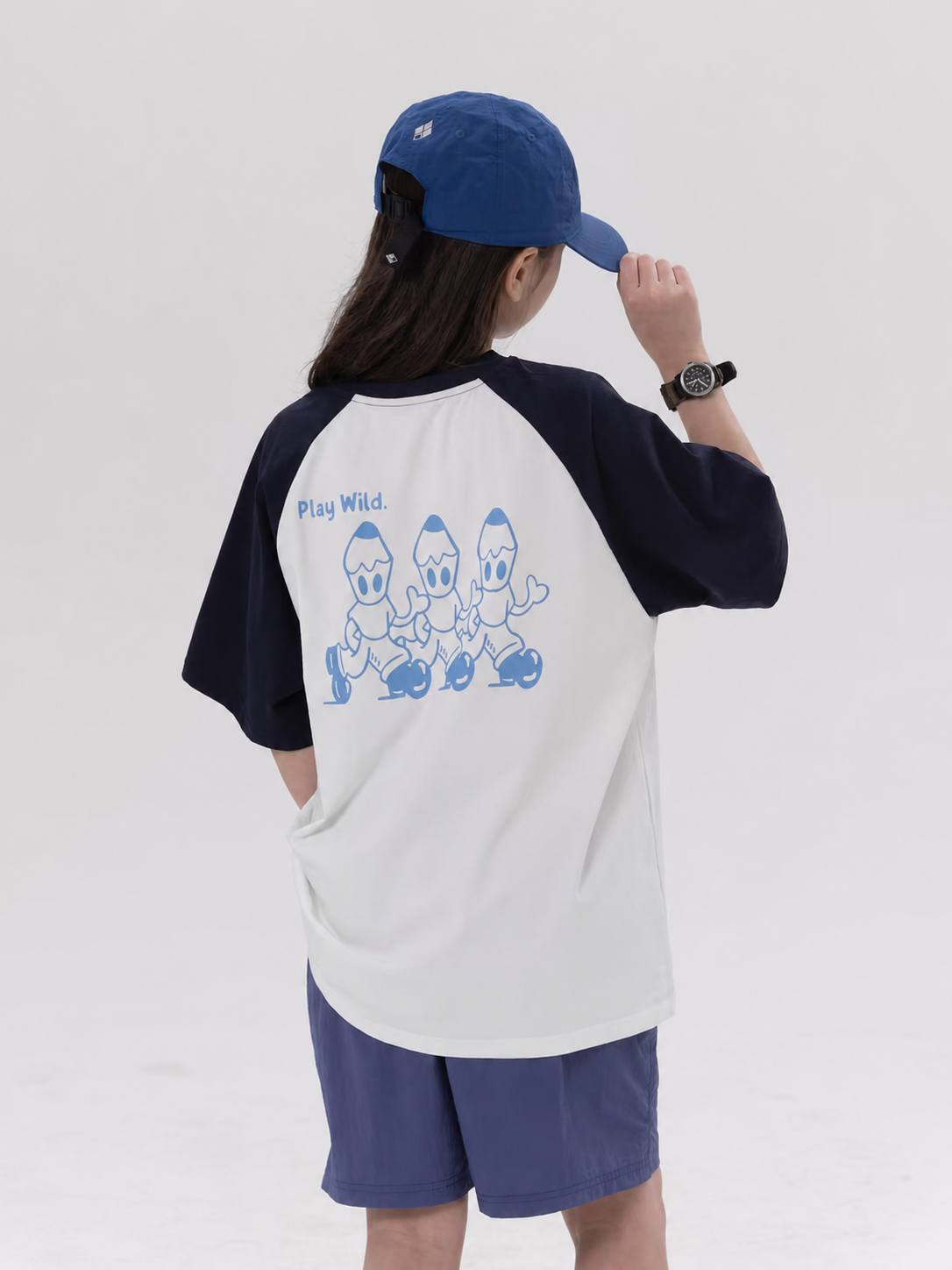 Play Wild kids quick-dry raglan tee in white and navy, back view