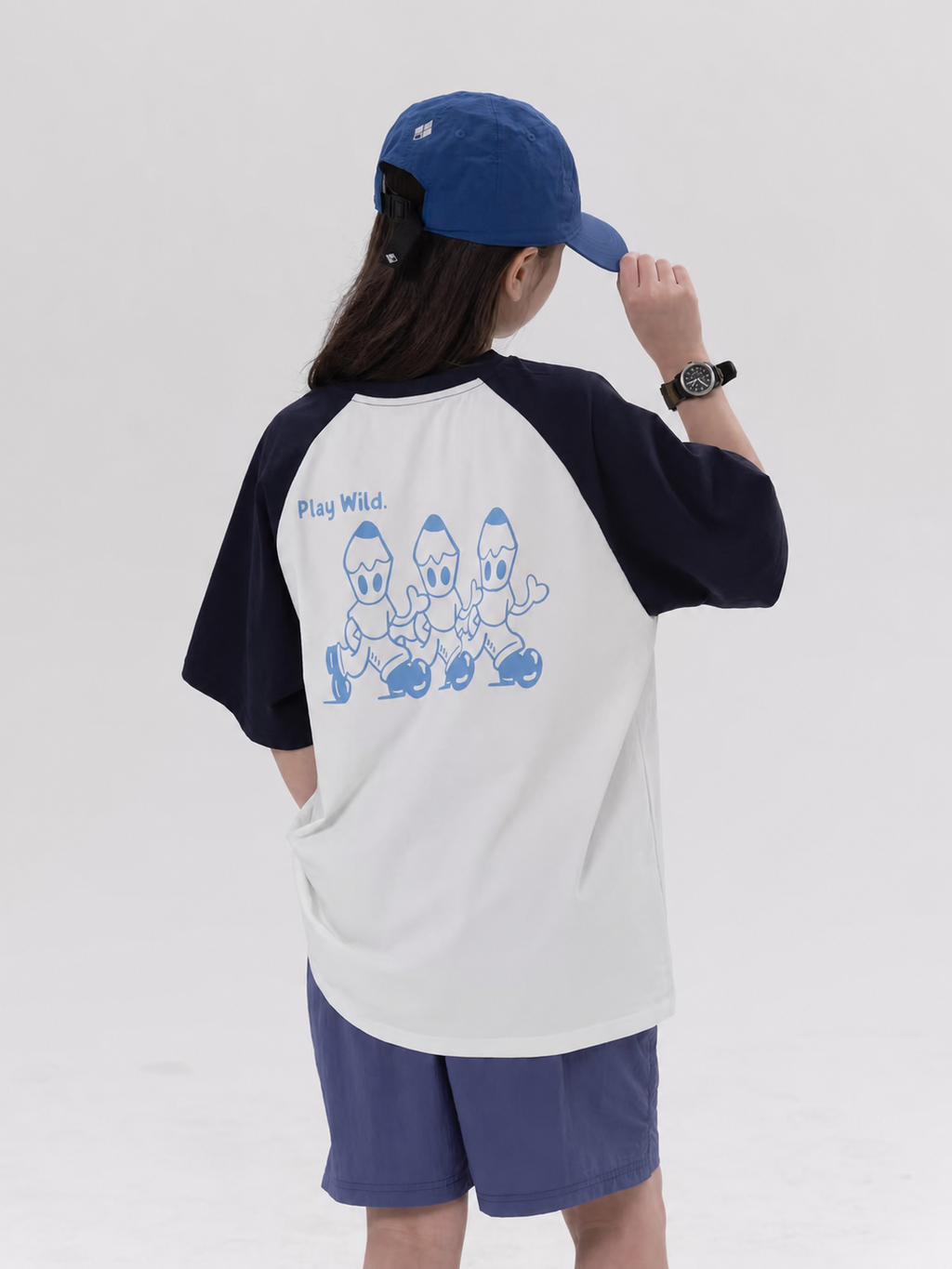 Play Wild kids quick-dry raglan tee in white and navy, back view