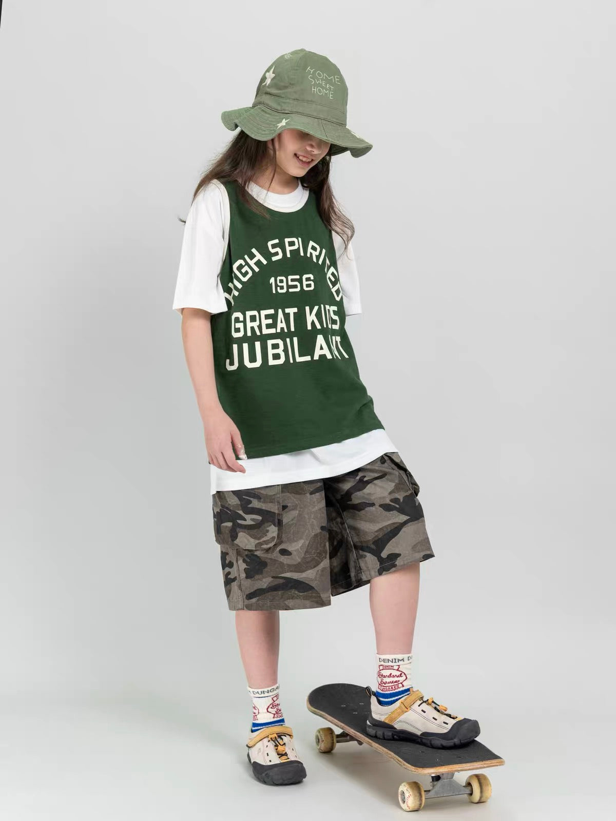Kids washed camouflage cargo shorts styled for skateboarding